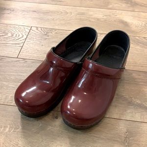 Dansko clogs in deep red.